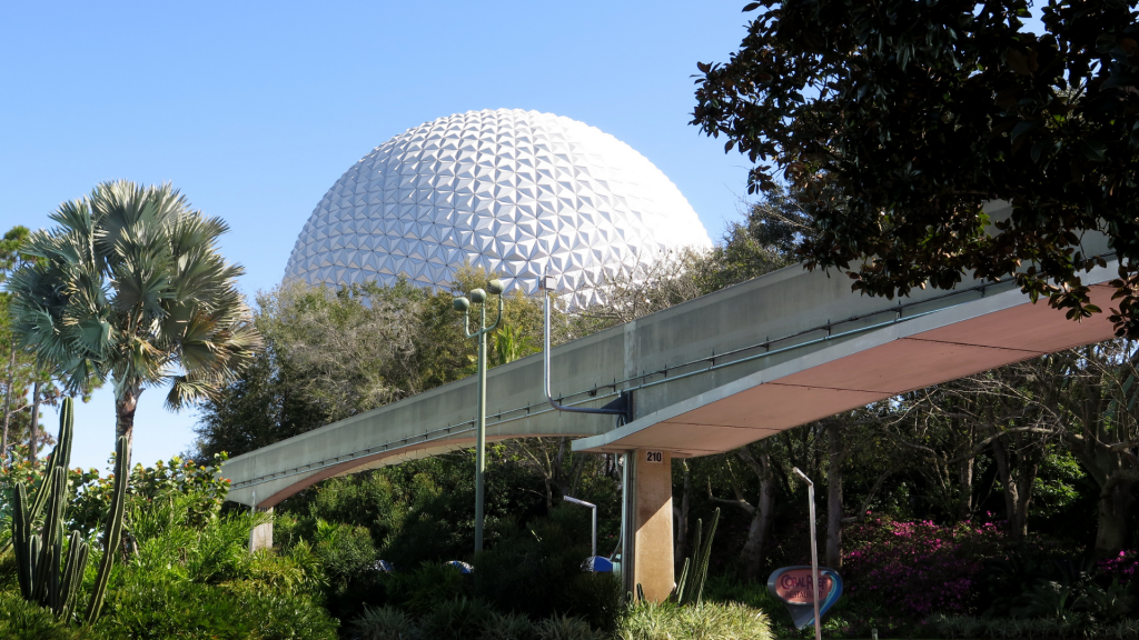 Shot of the Epcott ball behind the monorail on a sunny day at Disneyworld